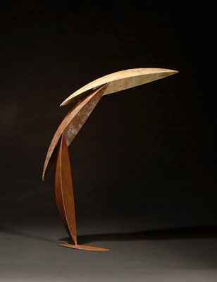 Leap - fabricated patinaed brass sculpture of three arcing segments appearing to spring off the table